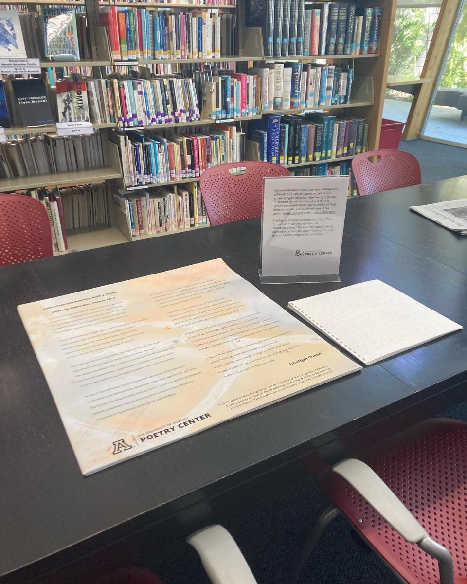 large print broadsides and braille poems at the library's center table