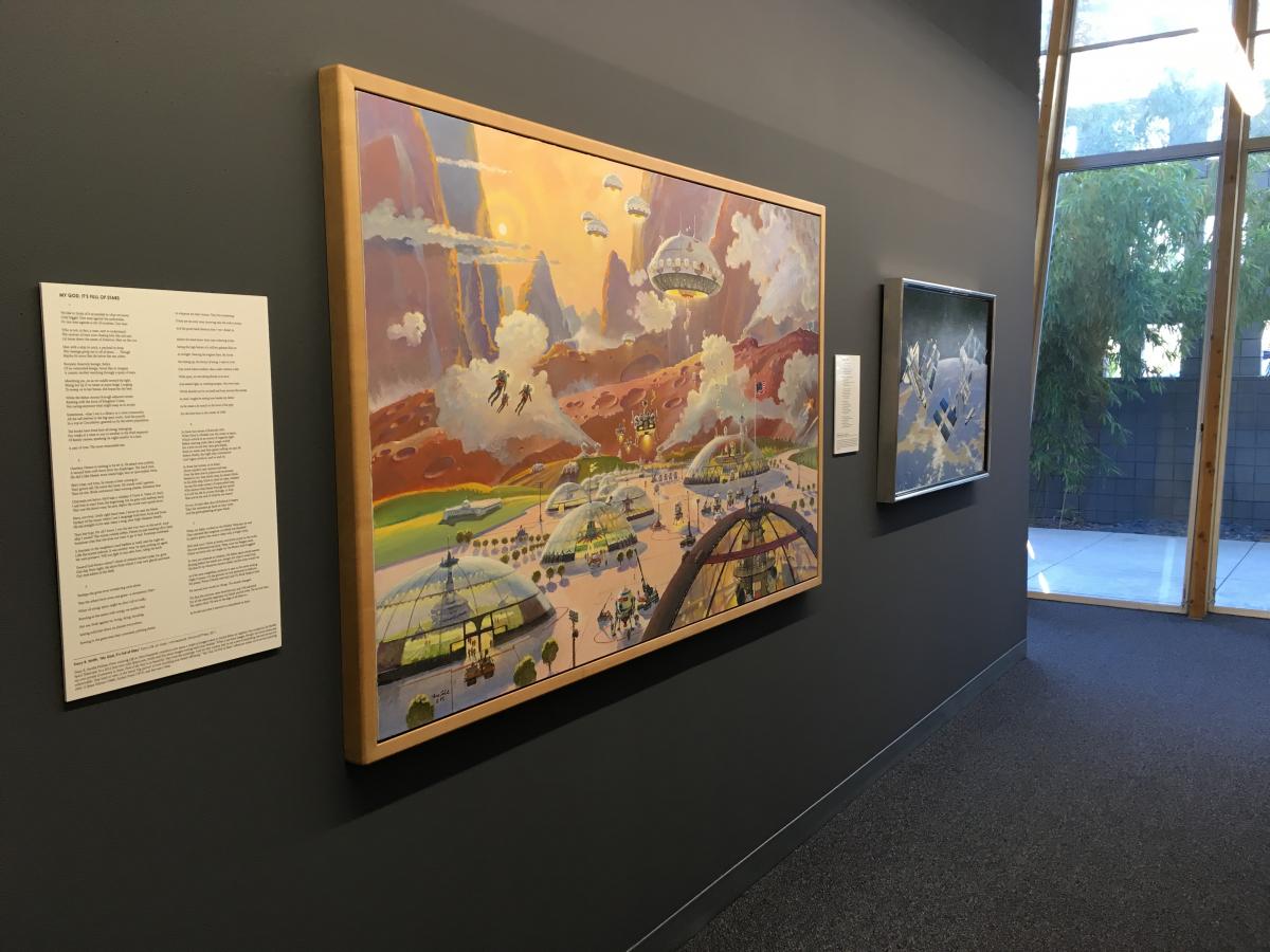 A large painting depicting a future human community on Mars displayed next to a poem.