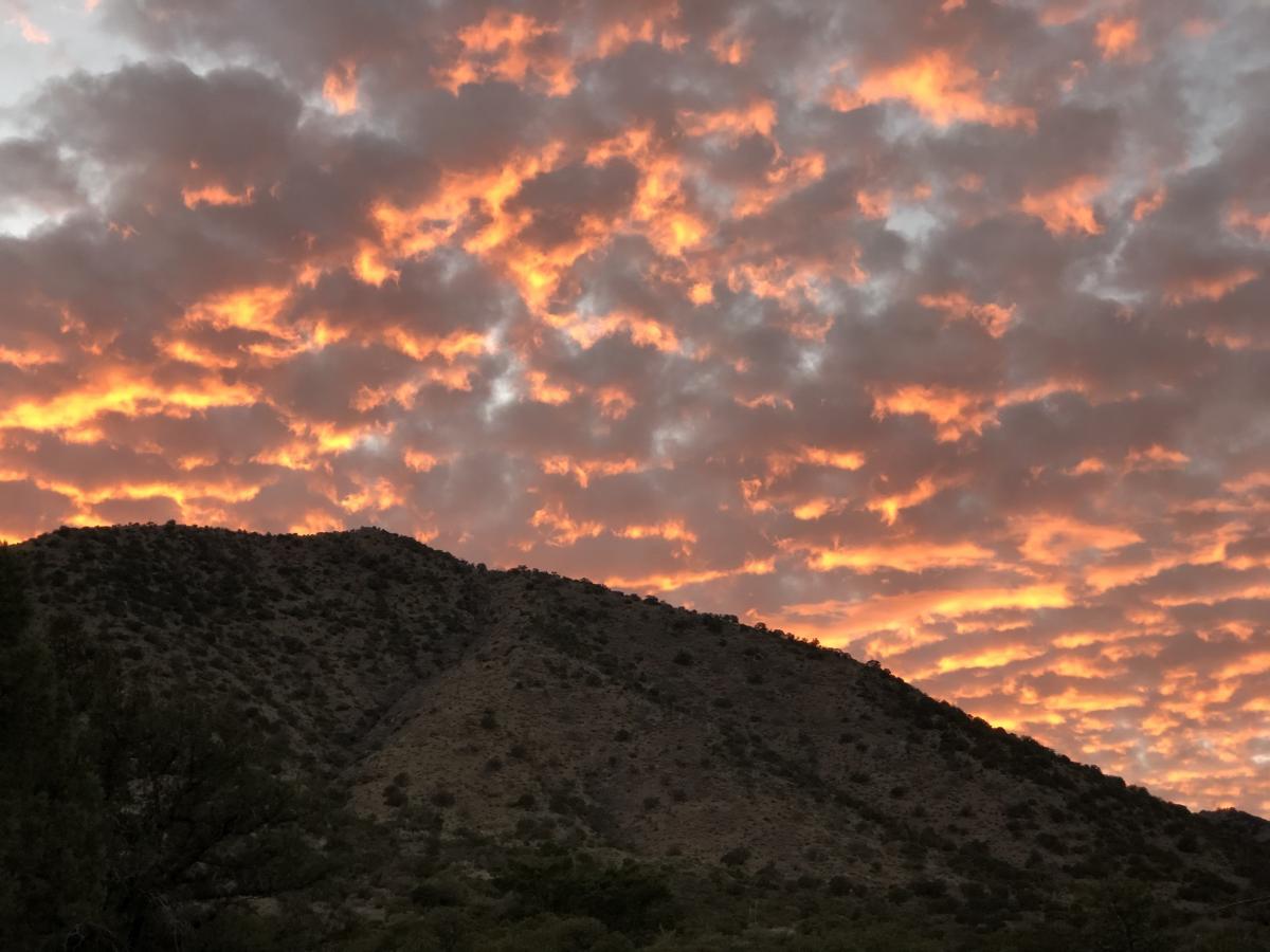 Sunset over a desert hill