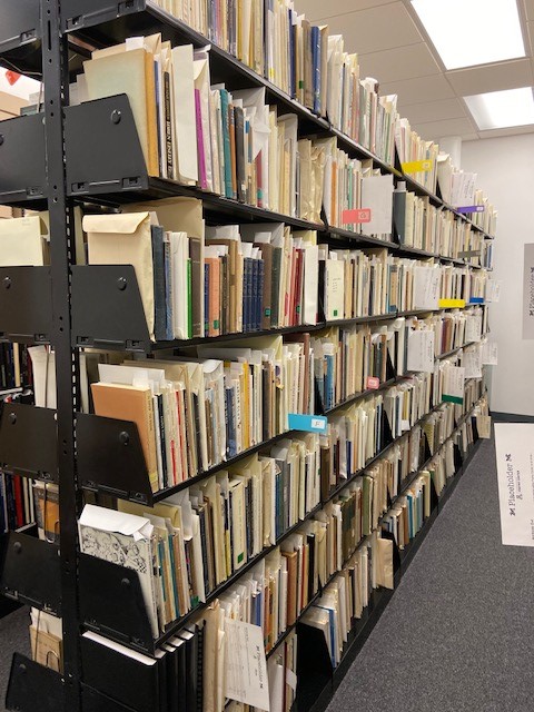 photo of shelves in the archives room