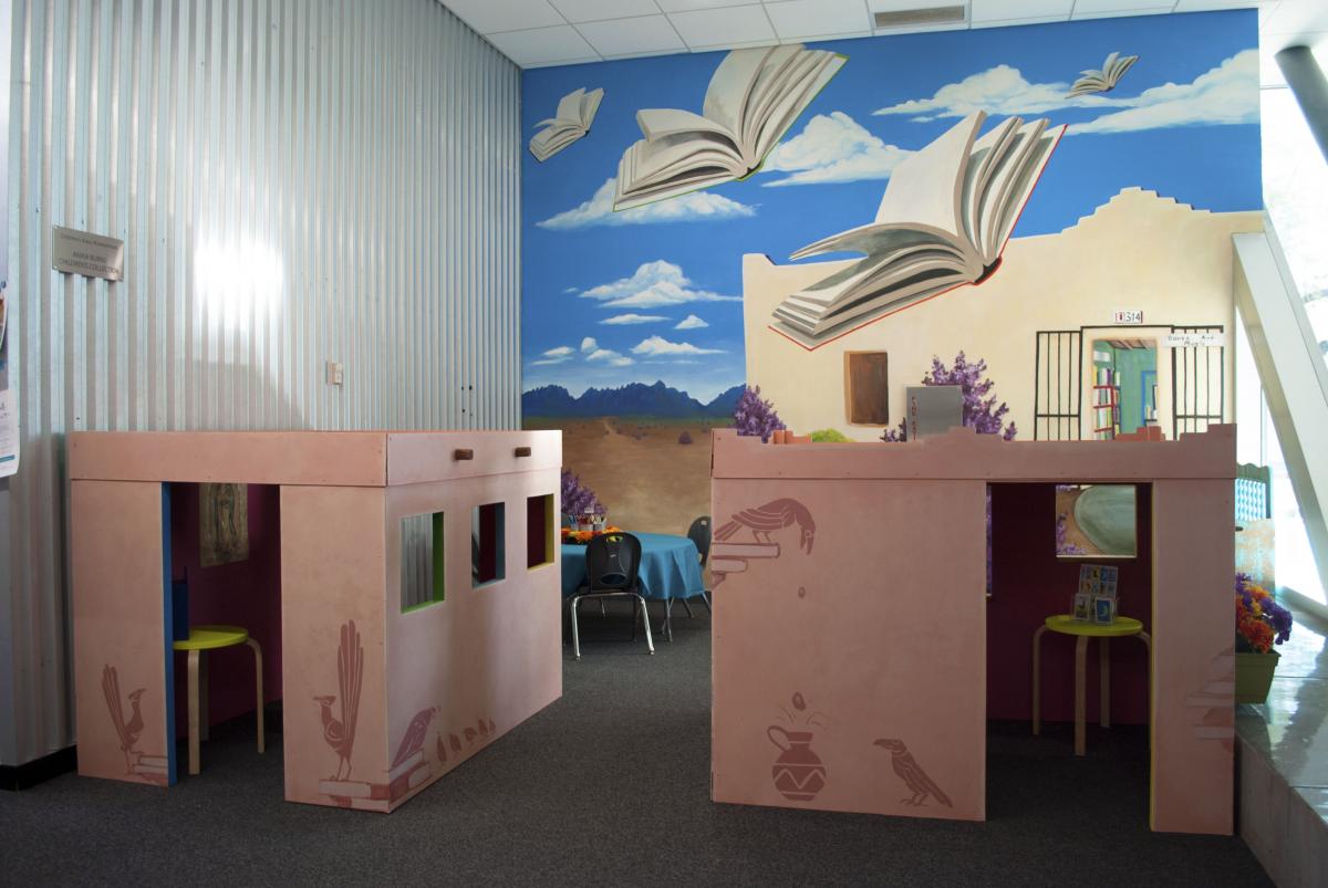 Brave Books area, with adobe playhouses and mural