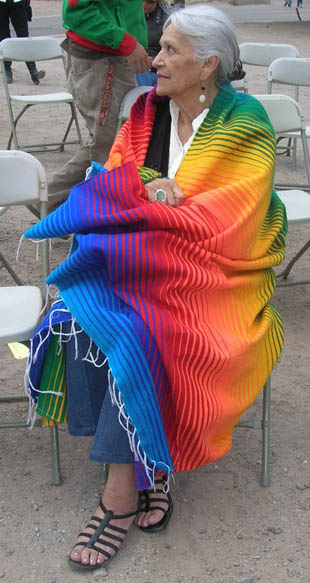 Faride Conway wrapped in a rainbow serape