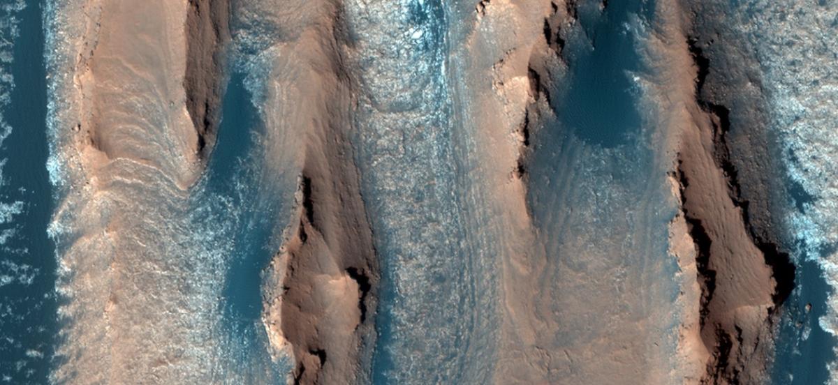 Tan and blue yardangs on Mars