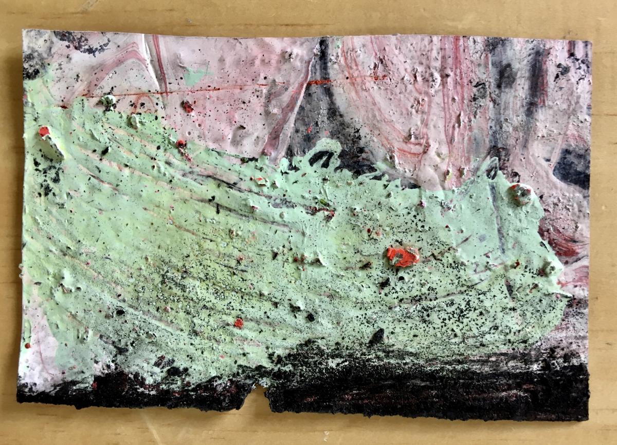 The front of a postcard painted in abstract swirls of green and pink.