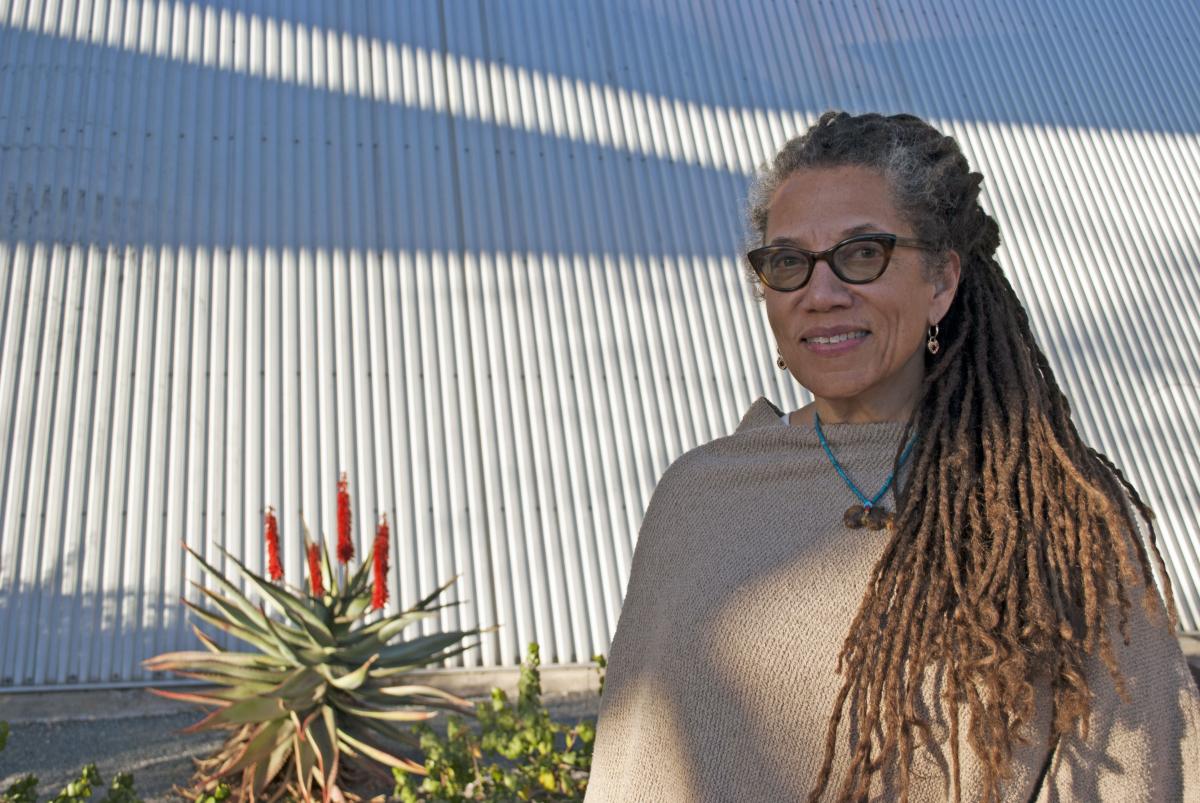 Nikky Finney stands in front of desert plants outside the Poetry Center, photo by Patri Hadad