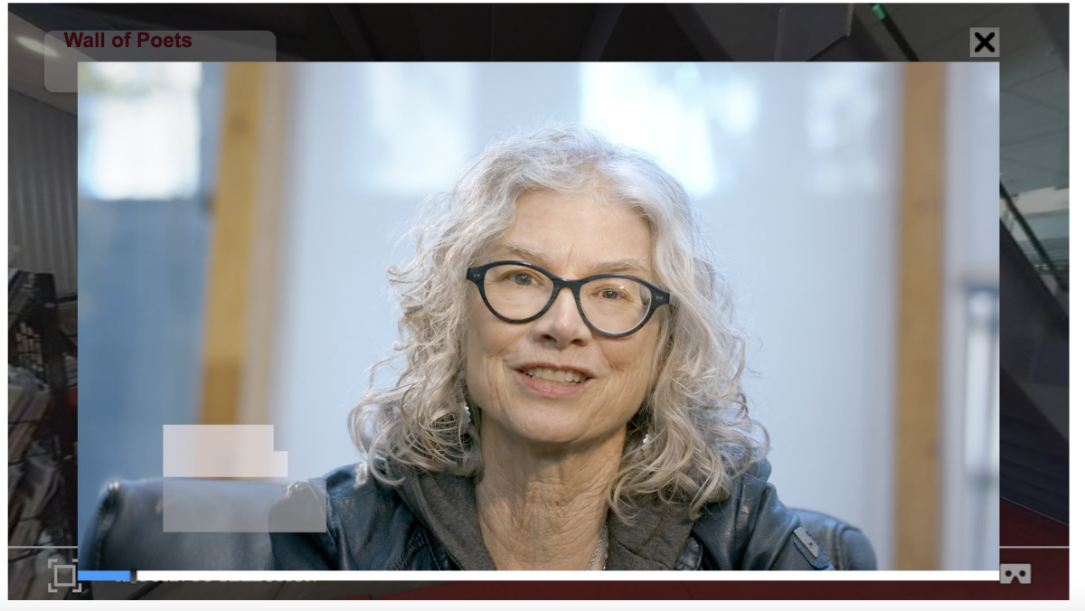 still of a video of Brenda Hillman, sitting in the Poetry Center