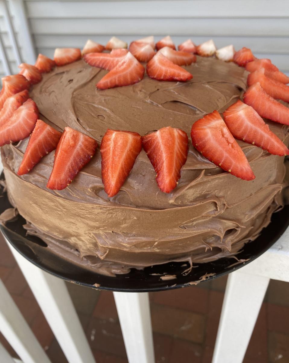 Picture of the thunder cake--chocolate frosting and topped with strawberries