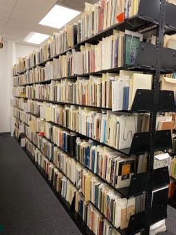 Photo of full shelving space in the Poetry Center's Archives room