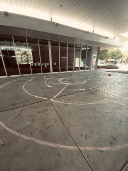 Photo of chalk labyrinth drawn in the Poetry Center breezeway