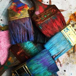 Dirty paint brushes in various colors, image by Rhonda K
