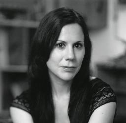 Jennifer Foerster looking directly into the camera, in black and white