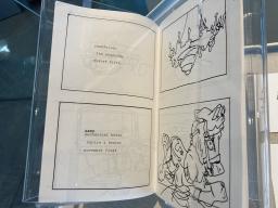 photo of an open book with poetry and drawings