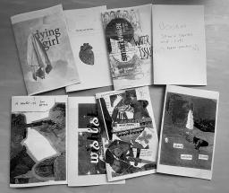 A black and white picture showing zines spread out on a table